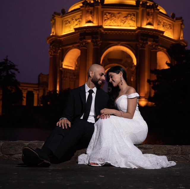Couple share a moment away from their wedding reception at the Palace of Fine Arts