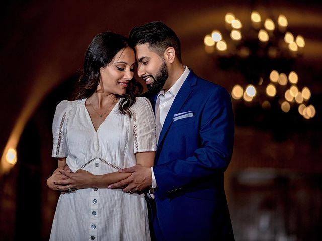 Indian couple hold each other during their engagement shoot in Northern California winery