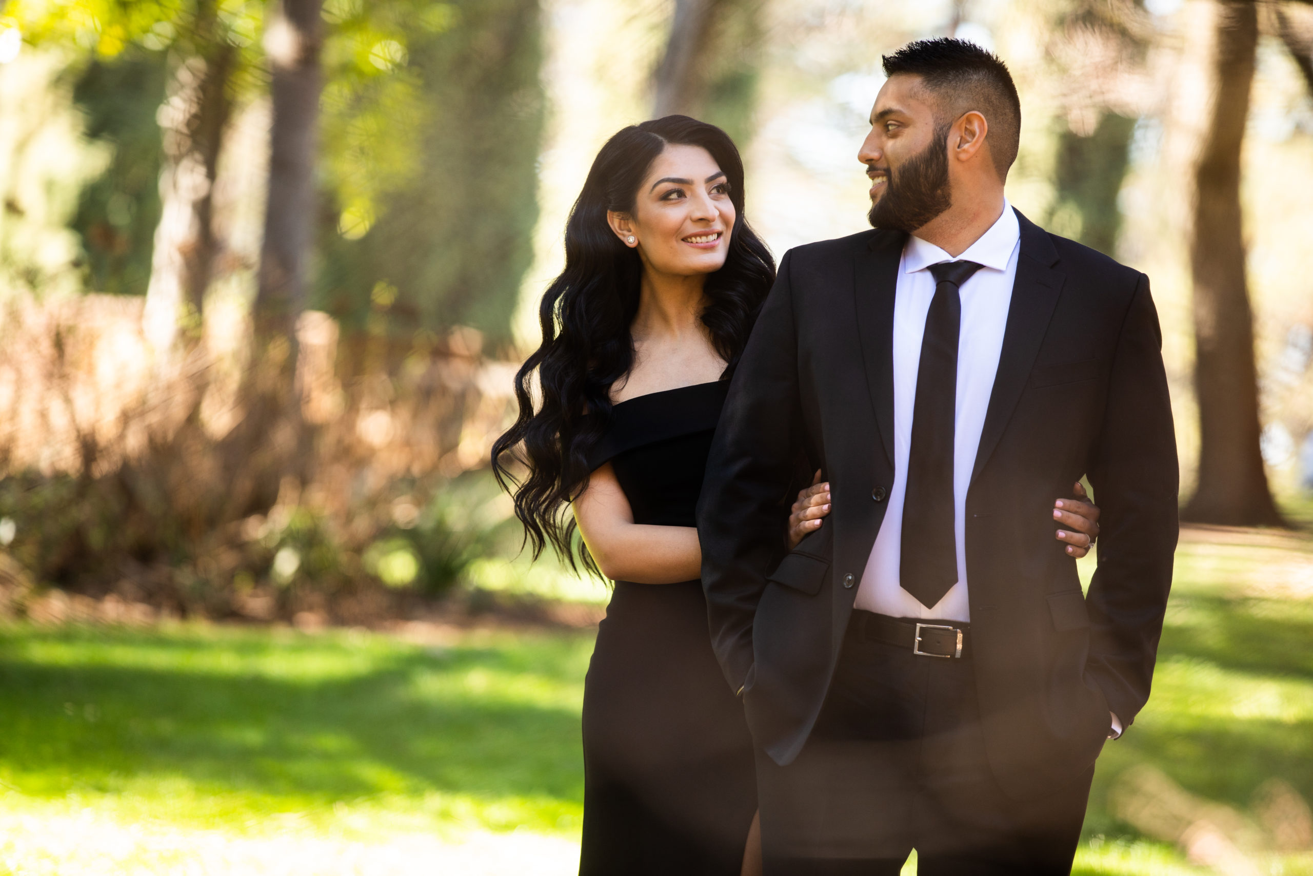 Engaged couple take a walk during their engagement shoot